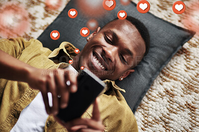 Buy stock photo Social media, love icon or black man with a phone for texting communication or online dating chat. Like, graphic overlay or relaxed person on mobile app website or digital network with heart emojis