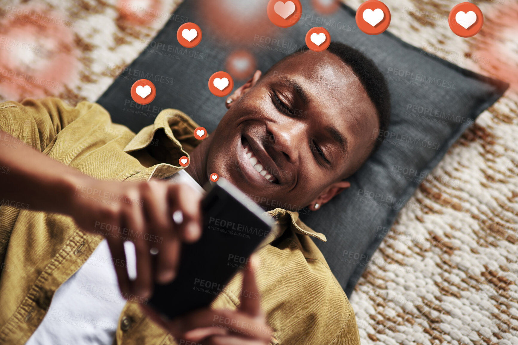 Buy stock photo Social media, love icon or black man with a phone for texting communication or online dating chat. Like, graphic overlay or relaxed person on mobile app website or digital network with heart emojis