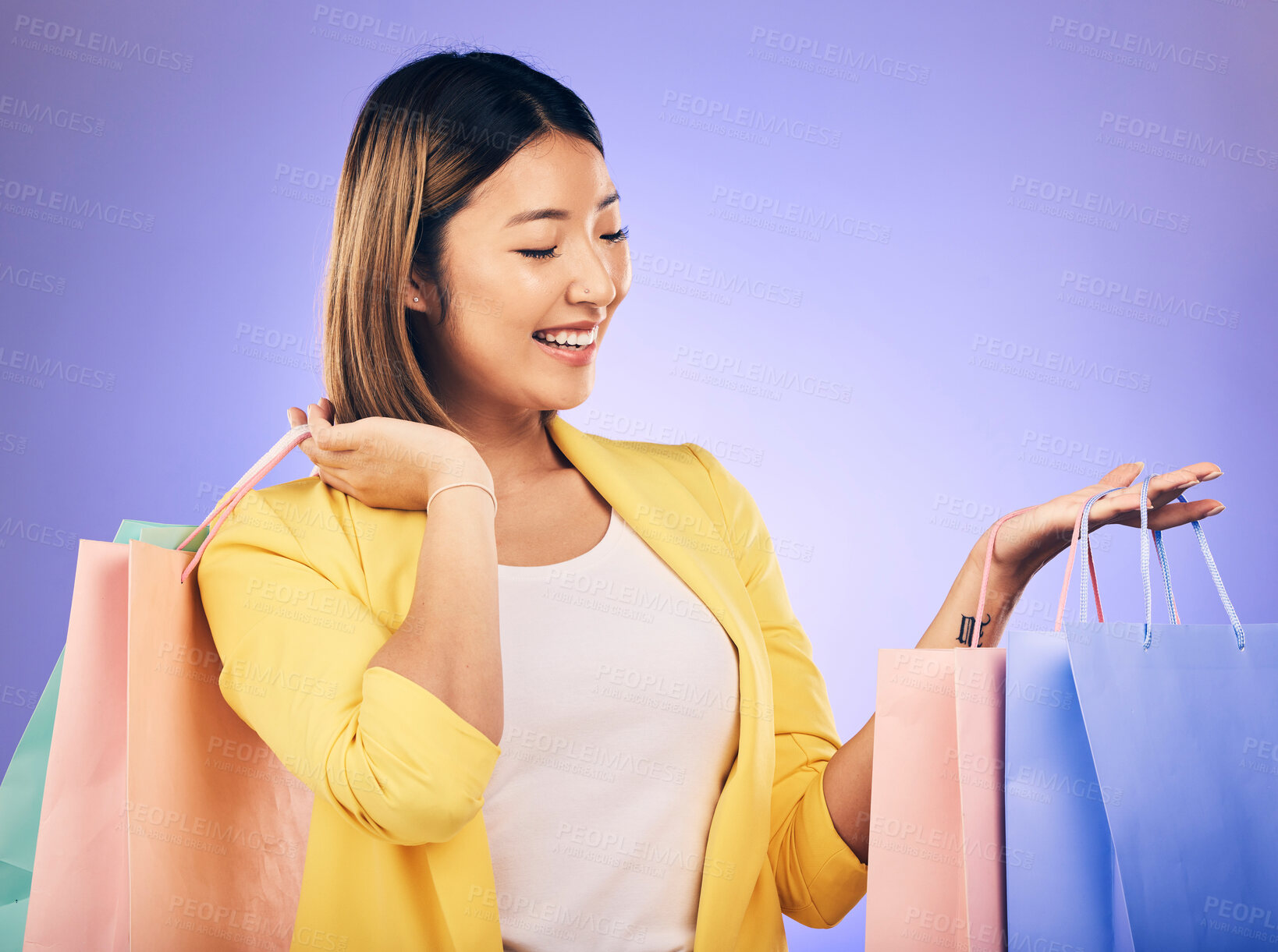 Buy stock photo Happy, face and woman with shopping bag from a sale, promotion or customer with deal on retail clothing. Asian model, shop for fashion and discount at market, mall or commercial store mockup