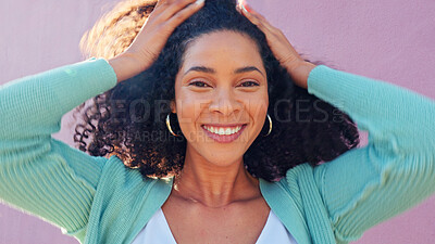 Buy stock photo Woman, natural hair and happy portrait with smile on pink background by wall with freedom. Fashion, style and trendy outfit of female person with afro hairstyle outdoor haircare and wind