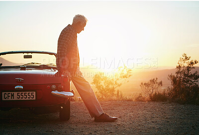 Buy stock photo Shot of a senior man out on a road trip