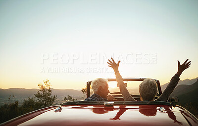 Buy stock photo Shot of a joyful senior couple enjoying  a road trip