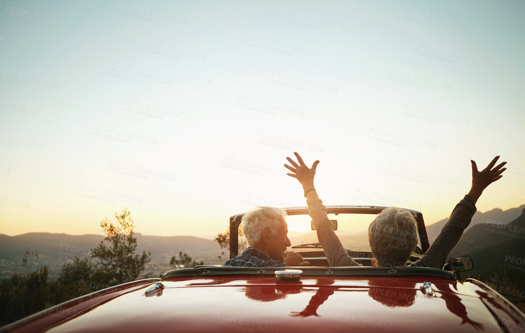 Buy stock photo Shot of a joyful senior couple enjoying  a road trip