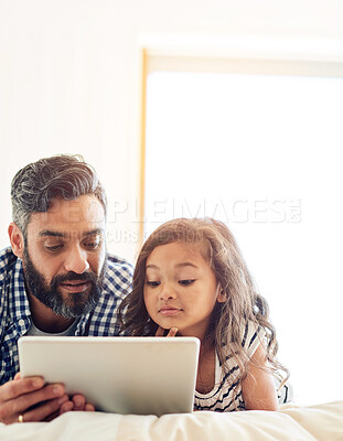 Buy stock photo Love, digital tablet and father with daughter on a bed for reading, story and learning in their home together. Family, streaming and parent and girl relax in bedroom online with ebook or subscription