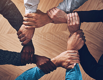 Buy stock photo Solidarity, holding or hands of business people with diversity for group support or teamwork in office. Community, link or above group of employees with mission or team building for goals together 