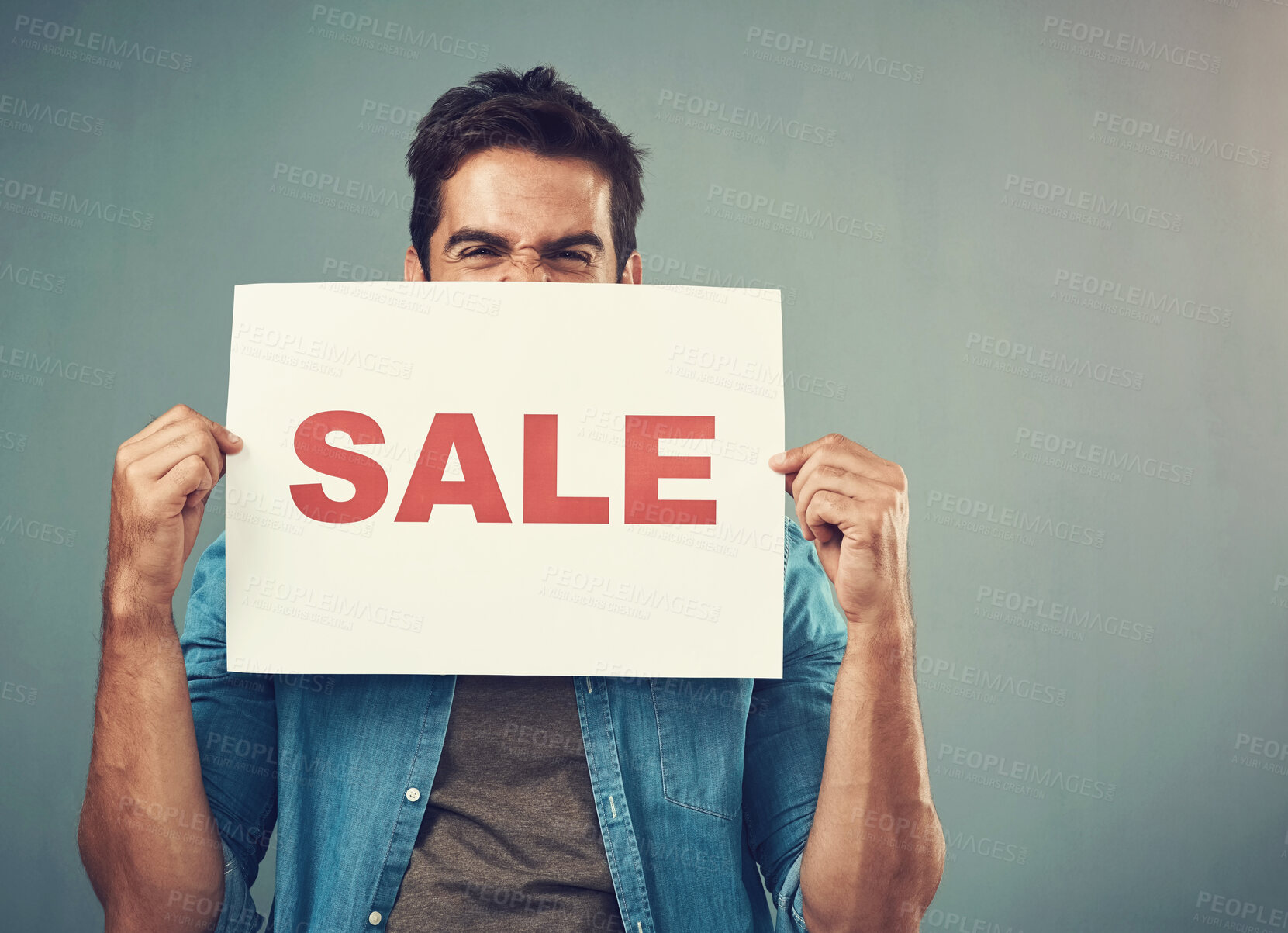 Buy stock photo Man, hands and sale sign for advertising, marketing or branding against a grey studio background. Excited male person or model holding billboard or poster for sales, announcement or advertisement