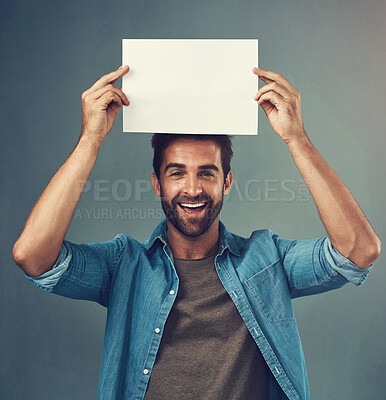 Buy stock photo Happy man, portrait and mockup billboard for advertising, marketing or branding against a grey studio background. Male person holding rectangle poster, placard or board for sign or advertisement