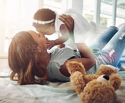 Buy stock photo Love, black woman and baby bonding on floor with kiss and happiness playing together in living room. Smile, mother and daughter in happy house, spending quality time for parent and newborn in home.