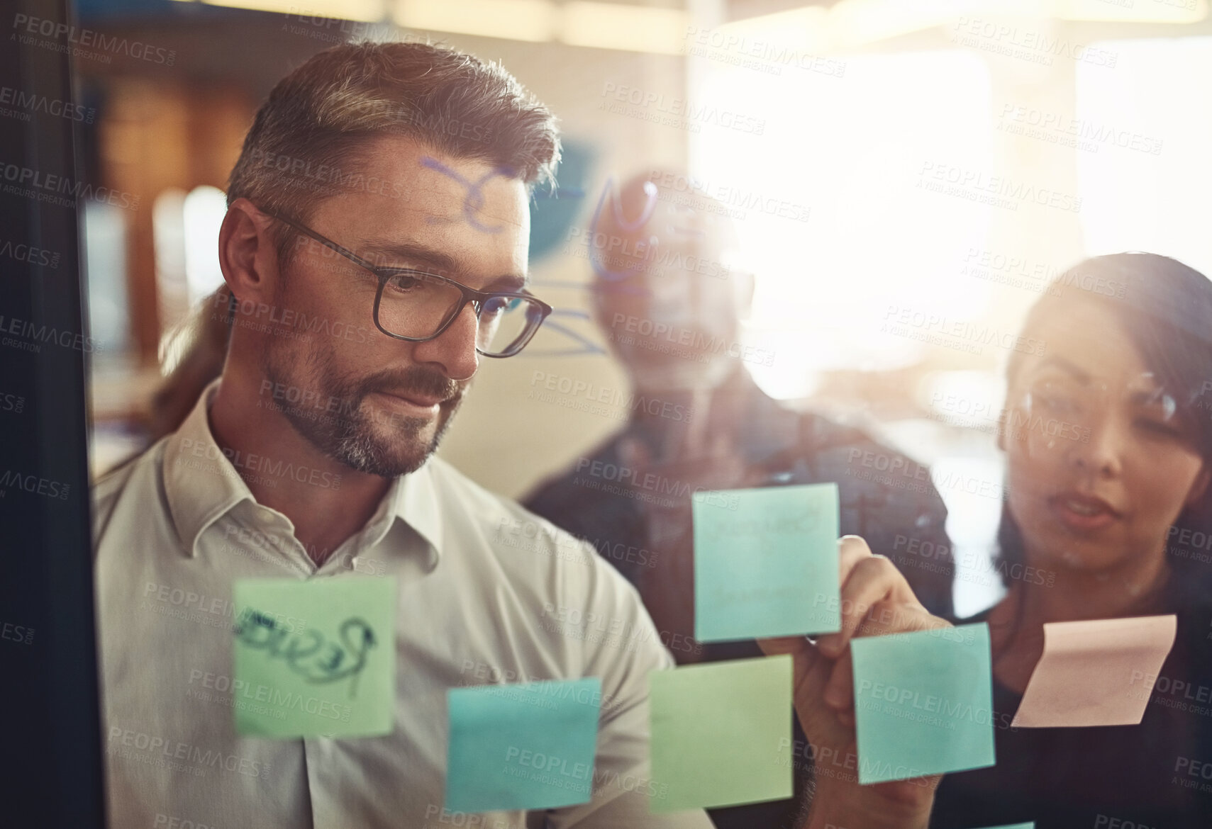 Buy stock photo Businessman, writing and team planning in strategy, brainstorming or schedule tasks at the office. Man DEO in leadership, presentation or training staff in project plan or meeting at workplace