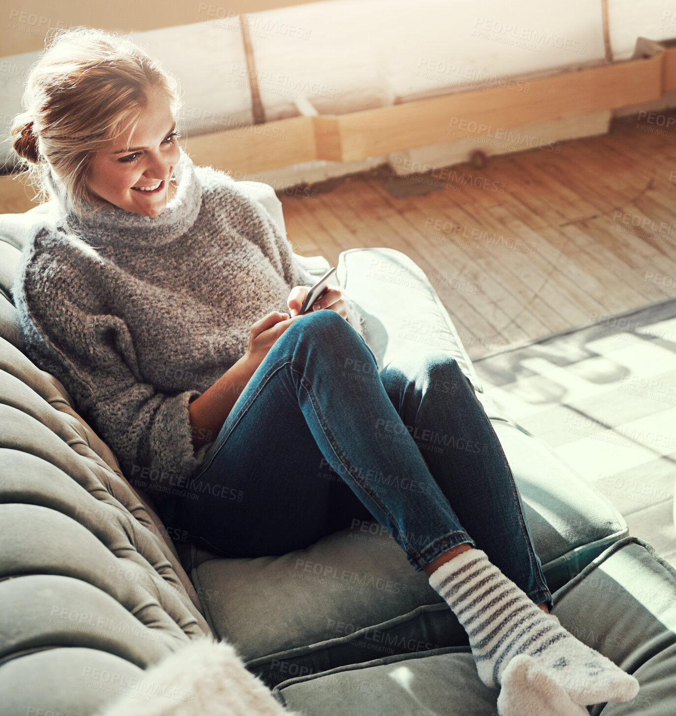 Buy stock photo Phone, house couch and happy woman on the web in a living room calm on a social media scroll. Home sofa, lounge and person relax on a mobile online on wifi with a smile from streaming content