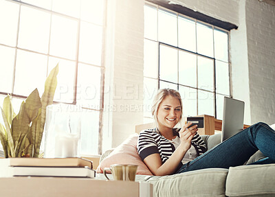 Buy stock photo Laptop, ecommerce and credit card of woman on sofa checking banking information on card for payment. Relaxed girl on home couch happy with online shopping transaction with satisfied smile.