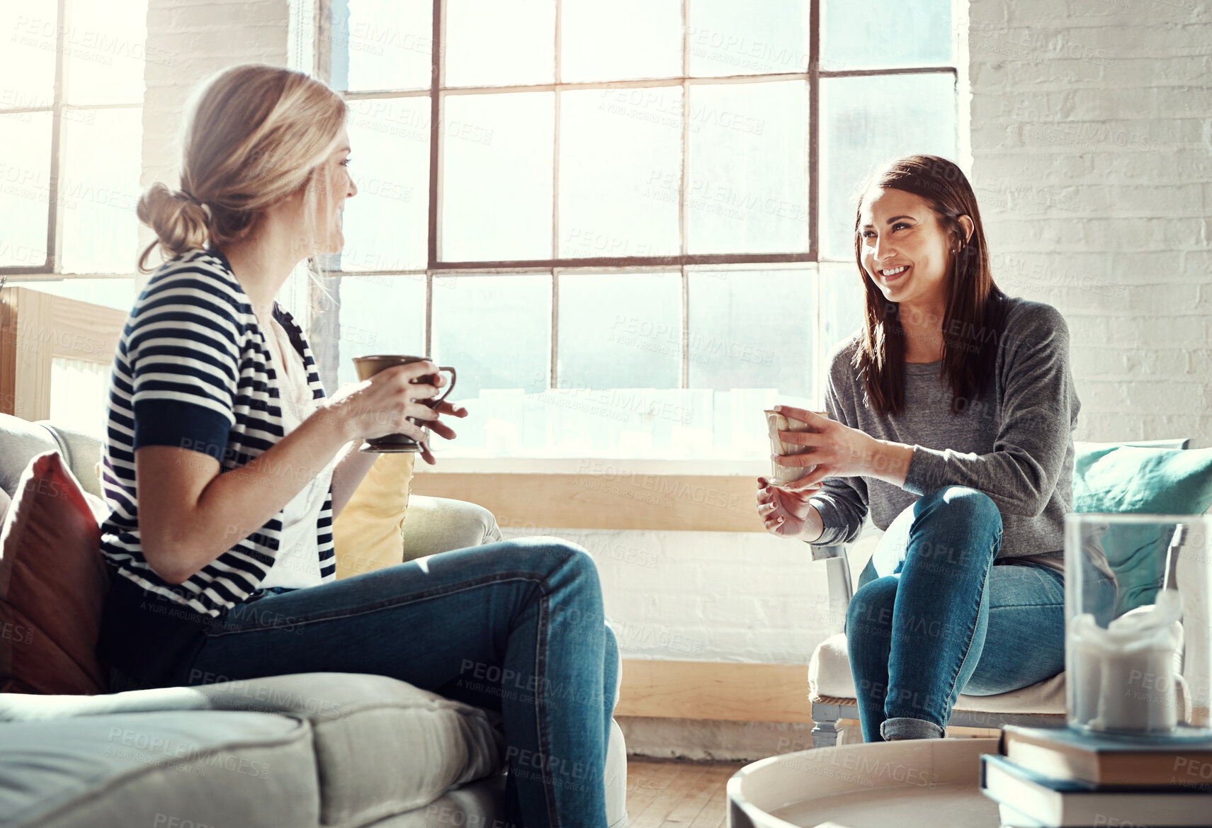 Buy stock photo Woman, friends and smile for coffee, conversation or social catch up relaxing together on living room sofa at home. Happy women enjoying tea time, chatting or gossip with drink in apartment on couch