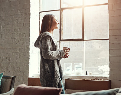 Buy stock photo Relax, coffee and woman looking out window from her home, thinking and daydreaming on a quiet morning. Daydream, tea and girl staring, contemplating and resting in her her living room on the weekend