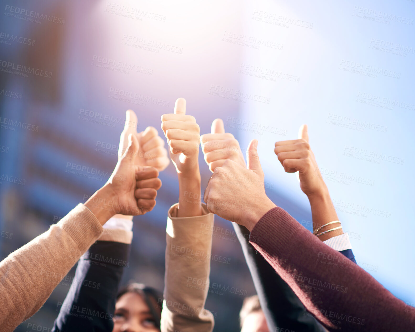 Buy stock photo Thumbs up, group or people in agreement with hands on blue sky outdoors. Teamwork, collaboration or community diversity and colleagues in support gesture outside in city background with flare mockup