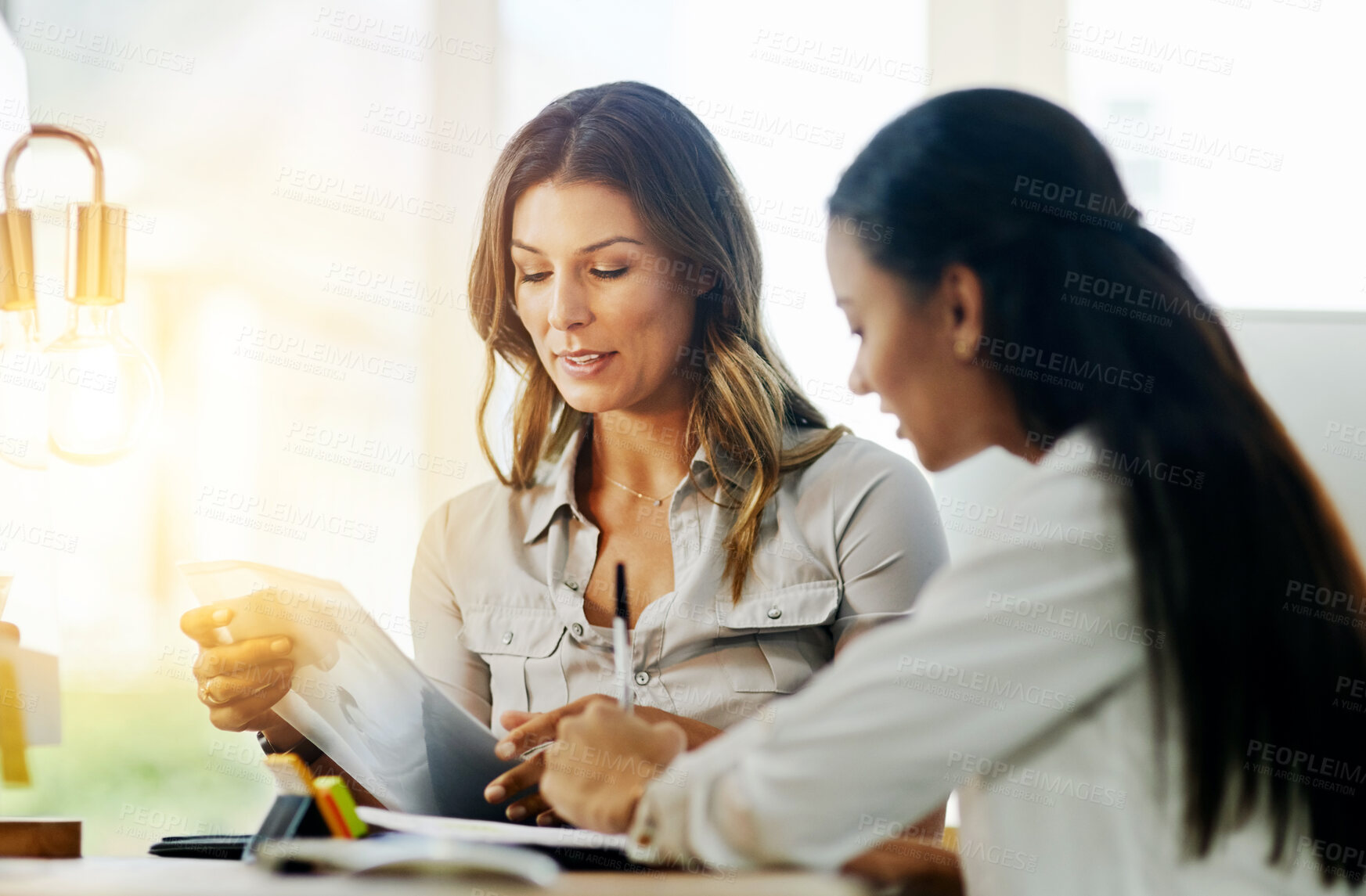 Buy stock photo Business women, file and talking for partnership, planning and paperwork in office together. Woman, teamwork and focus with documents, notes or schedule at job for collaboration, consulting or advice