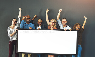 Buy stock photo Happy, diverse and cheering marketing team with a blank card, poster or billboard with copyspace in studio on a grey background. A group of smiling business people celebrating and endorsing a product