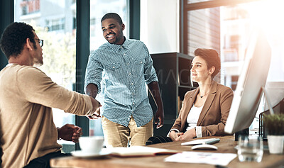 Buy stock photo Shot of designer shaking hands in the office