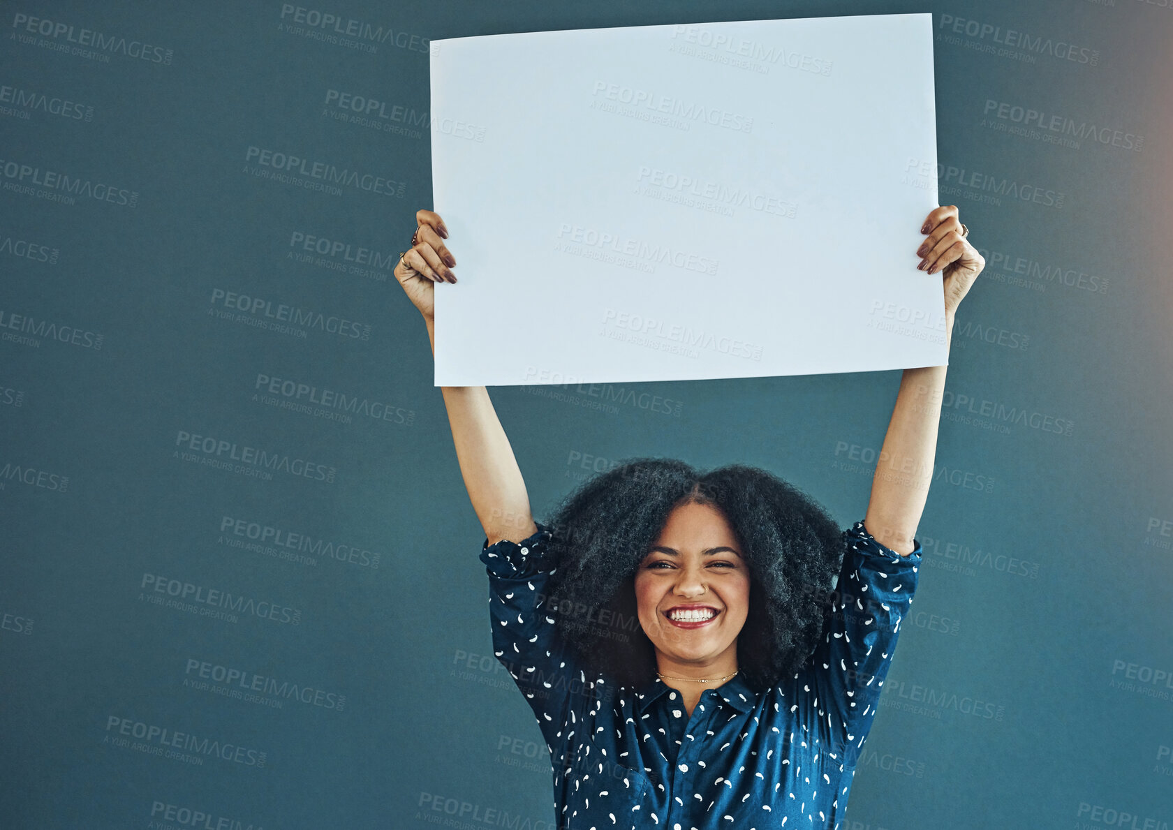 Buy stock photo Poster, mockup and portrait of happy woman in studio with banner for news, social media or advertising on blue background. Space, sign and female smile with paper, board and branding promotion