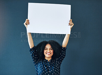 Buy stock photo Paper, mockup and portrait of happy woman in studio with banner for news, social media or advertising on blue background. Space, billboard and female smile with poster, sticker and branding promotion