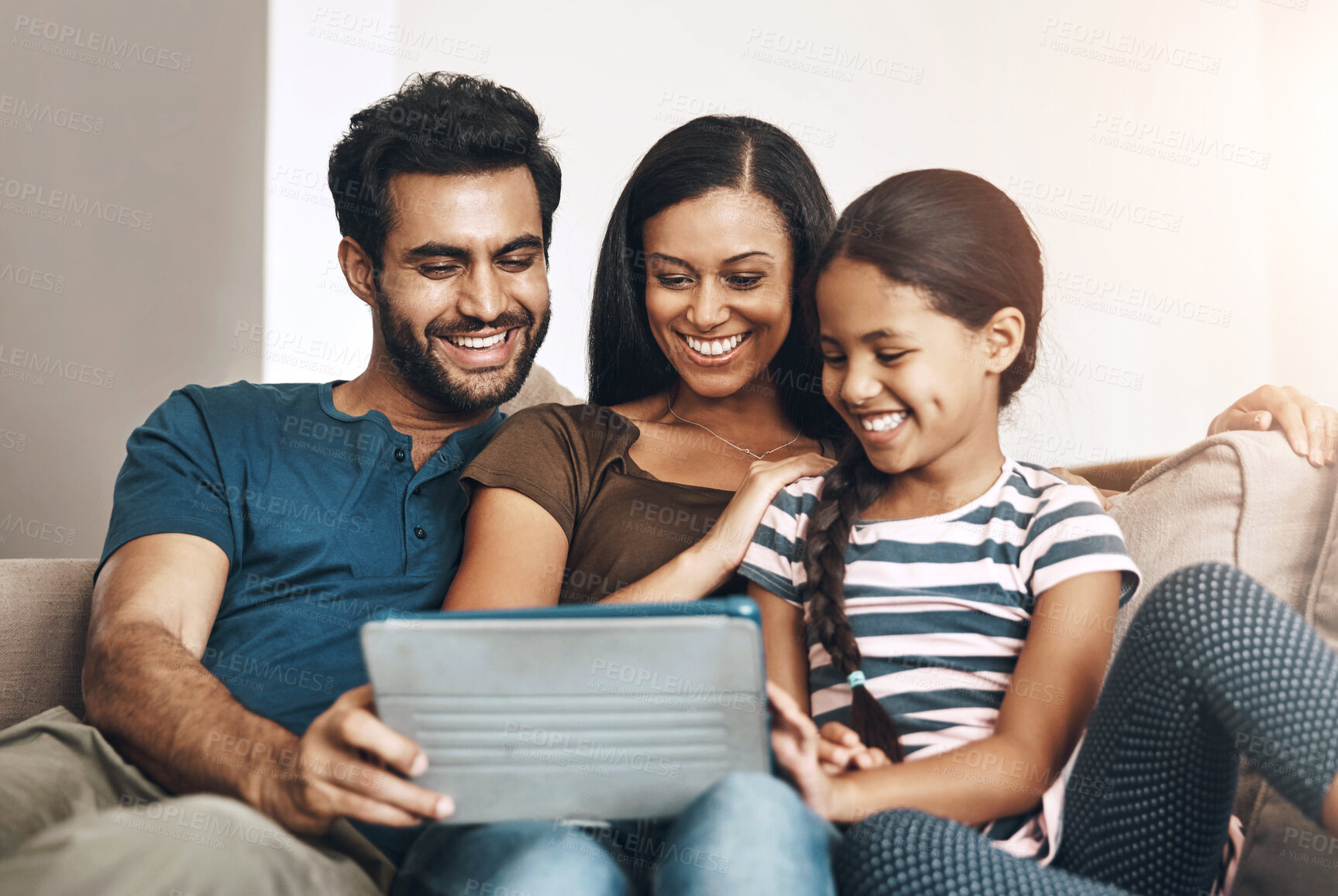 Buy stock photo Relax, smile and family on a sofa, tablet and bonding at home, connection and streaming a movie. Parents, mother and father on a couch, games and female child in the living room with cartoon film