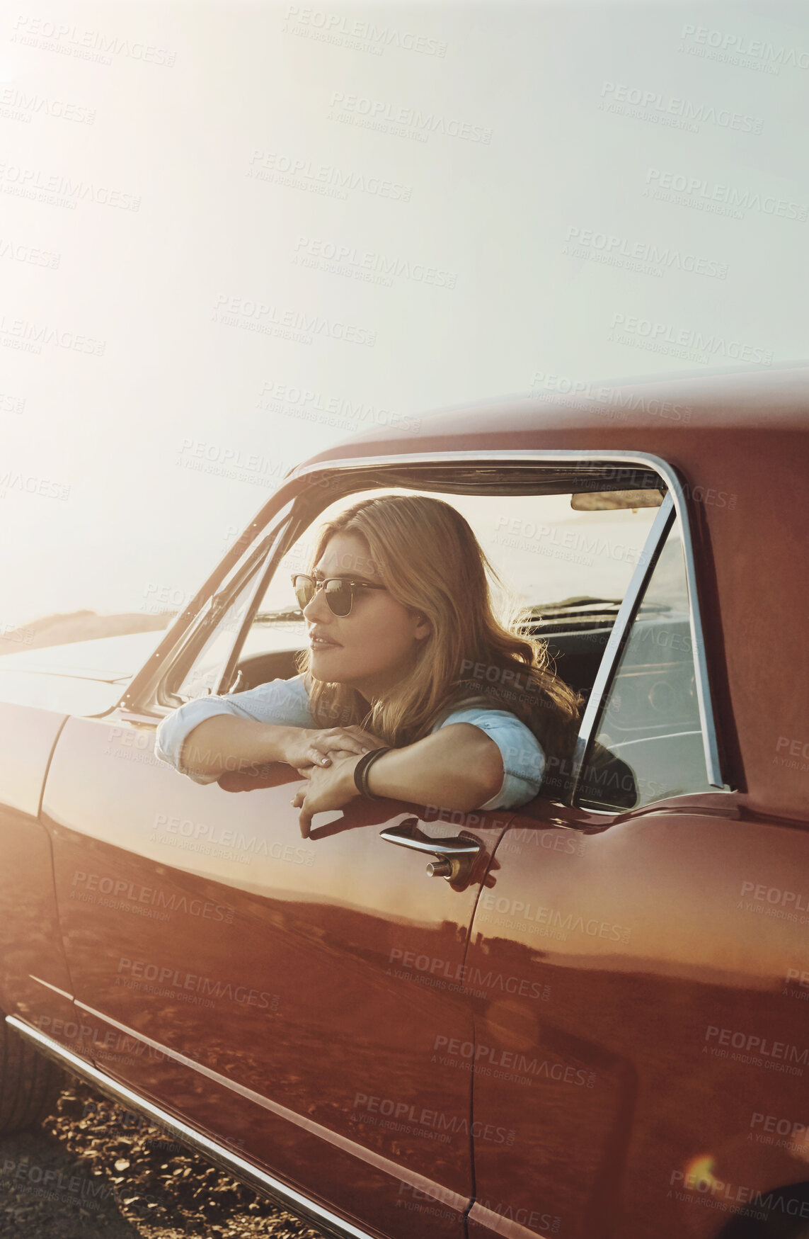 Buy stock photo Road trip, woman and thinking in car at sunset, cross country journey and travel in evening. Gen z girl, daydream and sunglasses on cliff for scenic view, freedom and idea on vacation with space