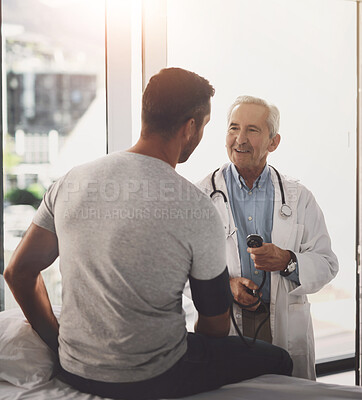 Buy stock photo Doctor, patient and man for blood pressure in healthcare with test for hypertension and happy with wellness check. Medical professional, person and consultation for vital signs and health assessment