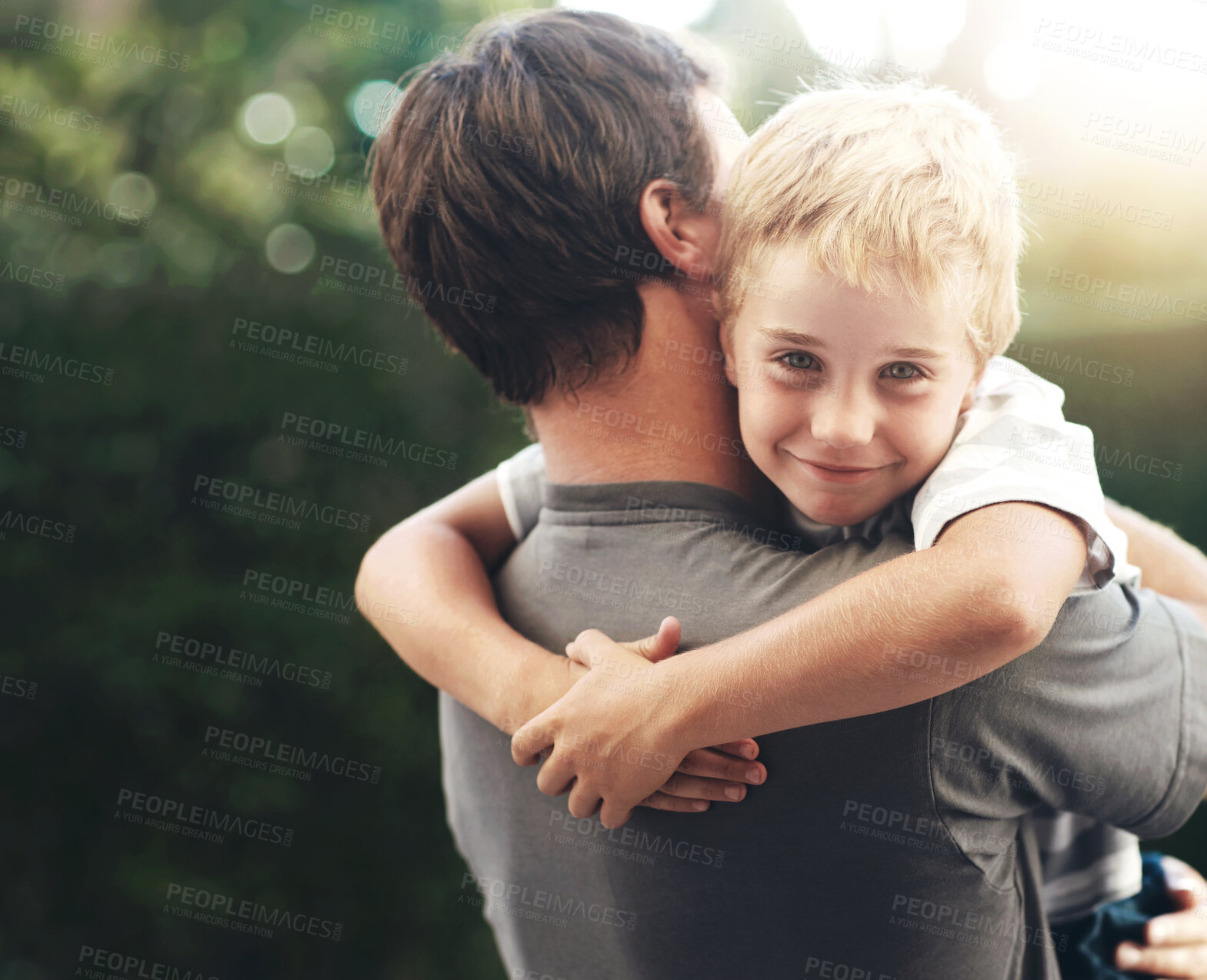 Buy stock photo Portrait of father hugging child in backyard, cute bonding together in care and love in garden. Outdoor fun, support and dad holding playful son with smile, trust and happy man with kid at playground