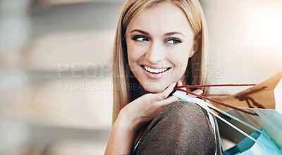 Buy stock photo Shot of an attractive young woman shopping