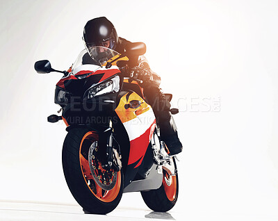 Buy stock photo Full length studio shot of a biker racing a superbike