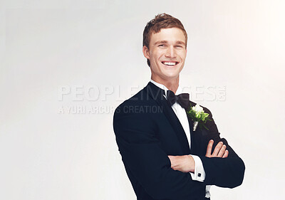 Buy stock photo Wedding, marriage and groom with a handsome man standing arms crossed in studio against a white background. Happy male in a suit or tuxedo with a smile ready to get married at a celebration event