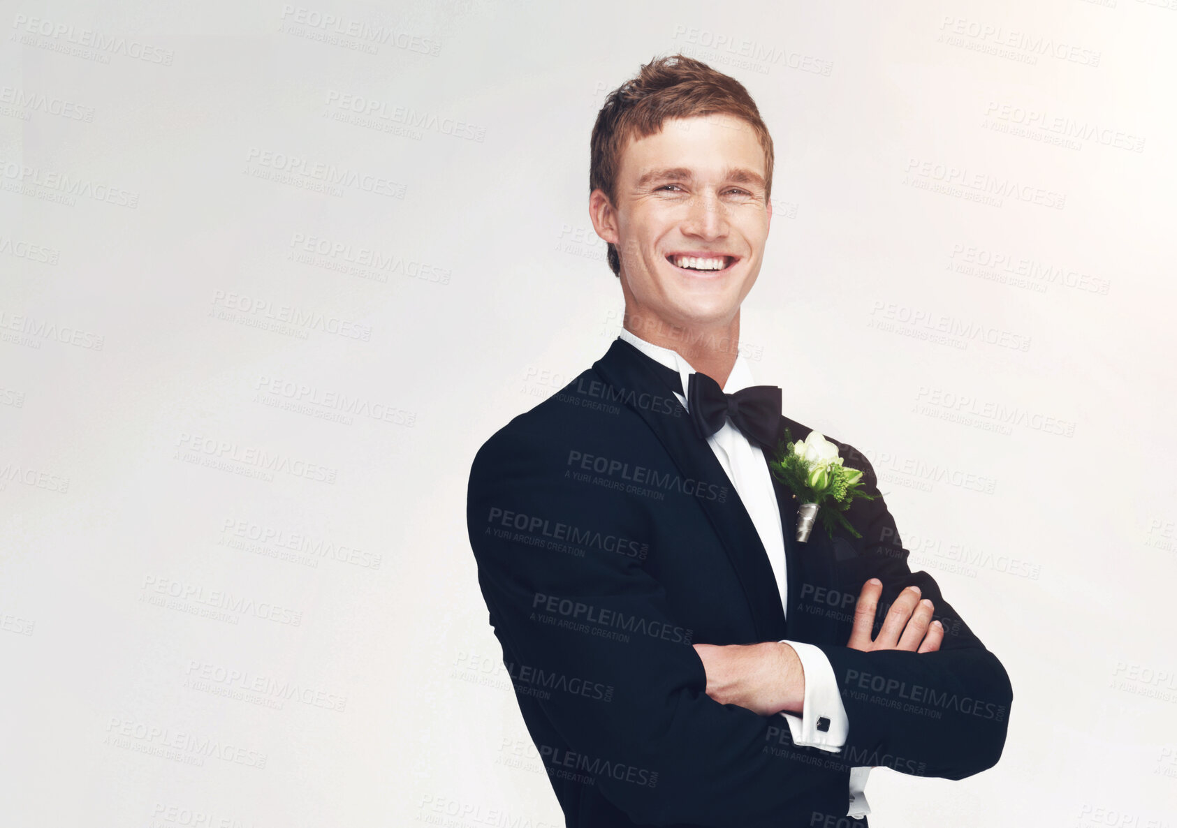 Buy stock photo Wedding, marriage and groom with a handsome man standing arms crossed in studio against a white background. Happy male in a suit or tuxedo with a smile ready to get married at a celebration event