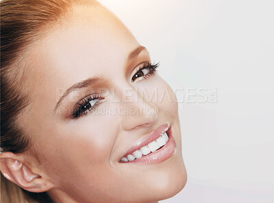 Buy stock photo Cropped closeup of a naturally beautiful woman with flawless skin smiling at you, isolated on white