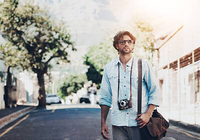 Buy stock photo Shot of a handsome young tourist checking out the sights