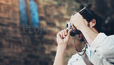 Buy stock photo Shot of a handsome young tourist checking out the sights