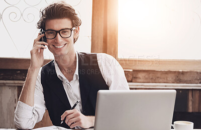 Buy stock photo A young man multi-tasking