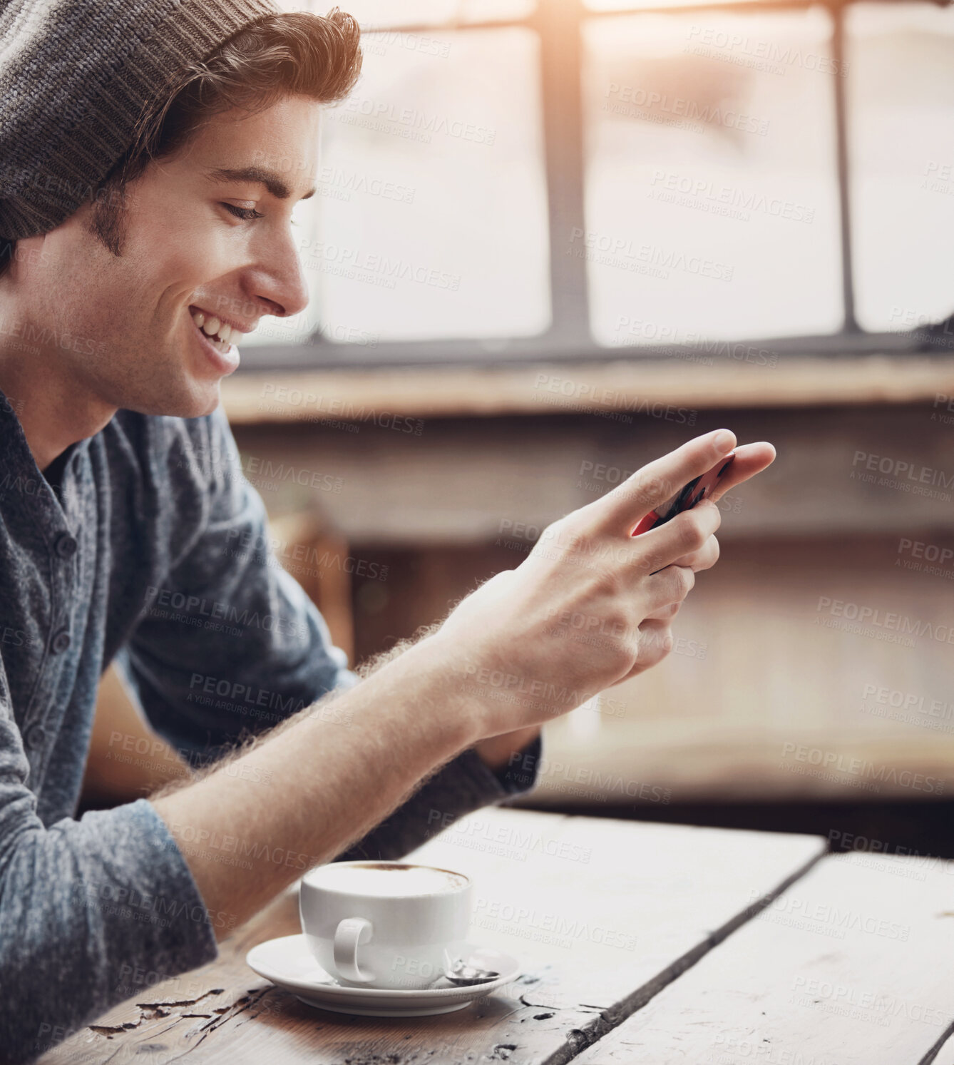 Buy stock photo Smile, cafe and man with a smartphone, typing and connection for social media, network and relax. Male person, happy guy and cellphone for texting, mobile app and online reading in a coffee shop