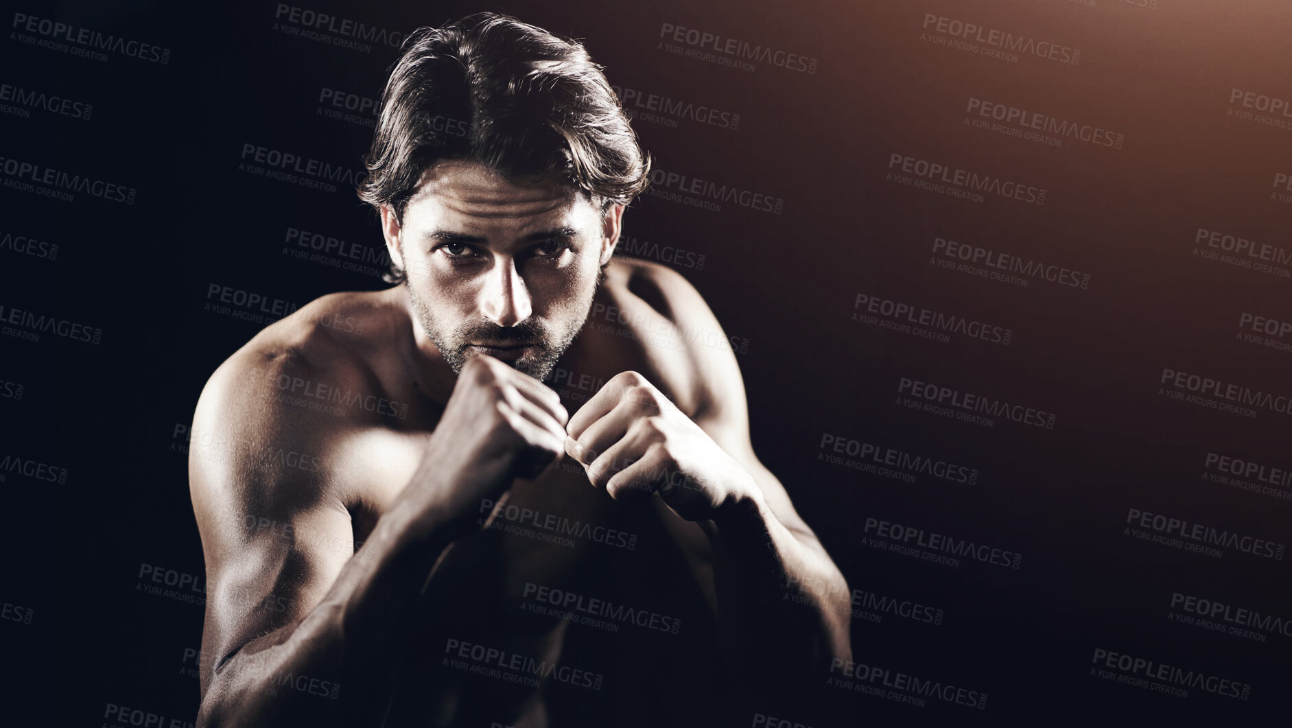 Buy stock photo Portrait of a muscular young boxer standing ready to fight