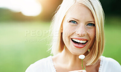 Buy stock photo Happy woman, portrait and face with flower, plant or dandelion in nature for outdoor environment. Female person or blonde smile with petal in happiness, eco friendly holiday or countryside vacation