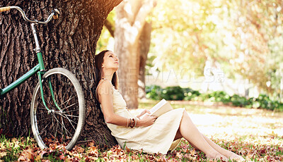 Buy stock photo Shot of an attractive young woman in the park on an autumn day