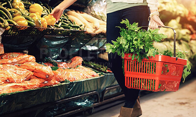 Buy stock photo Cropped image of a woman shopping at the grocery store