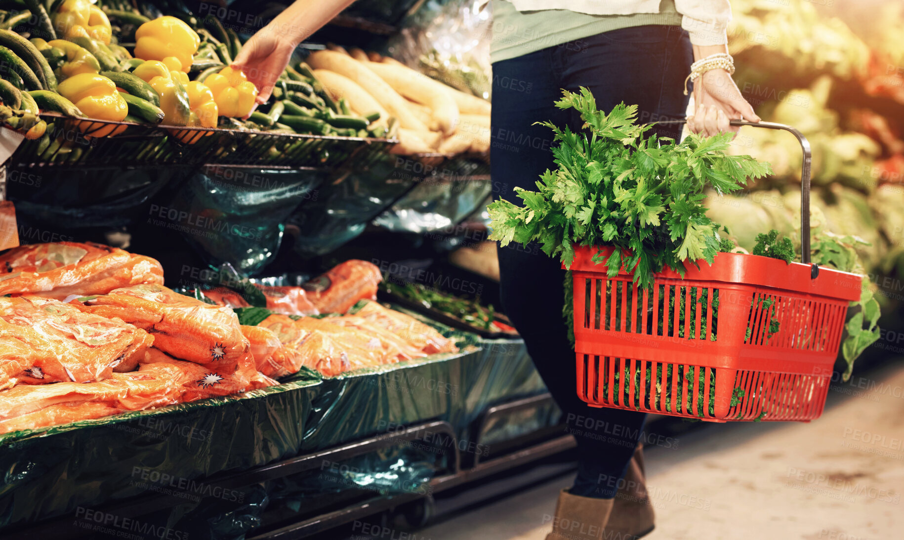 Buy stock photo Cropped image of a woman shopping at the grocery store