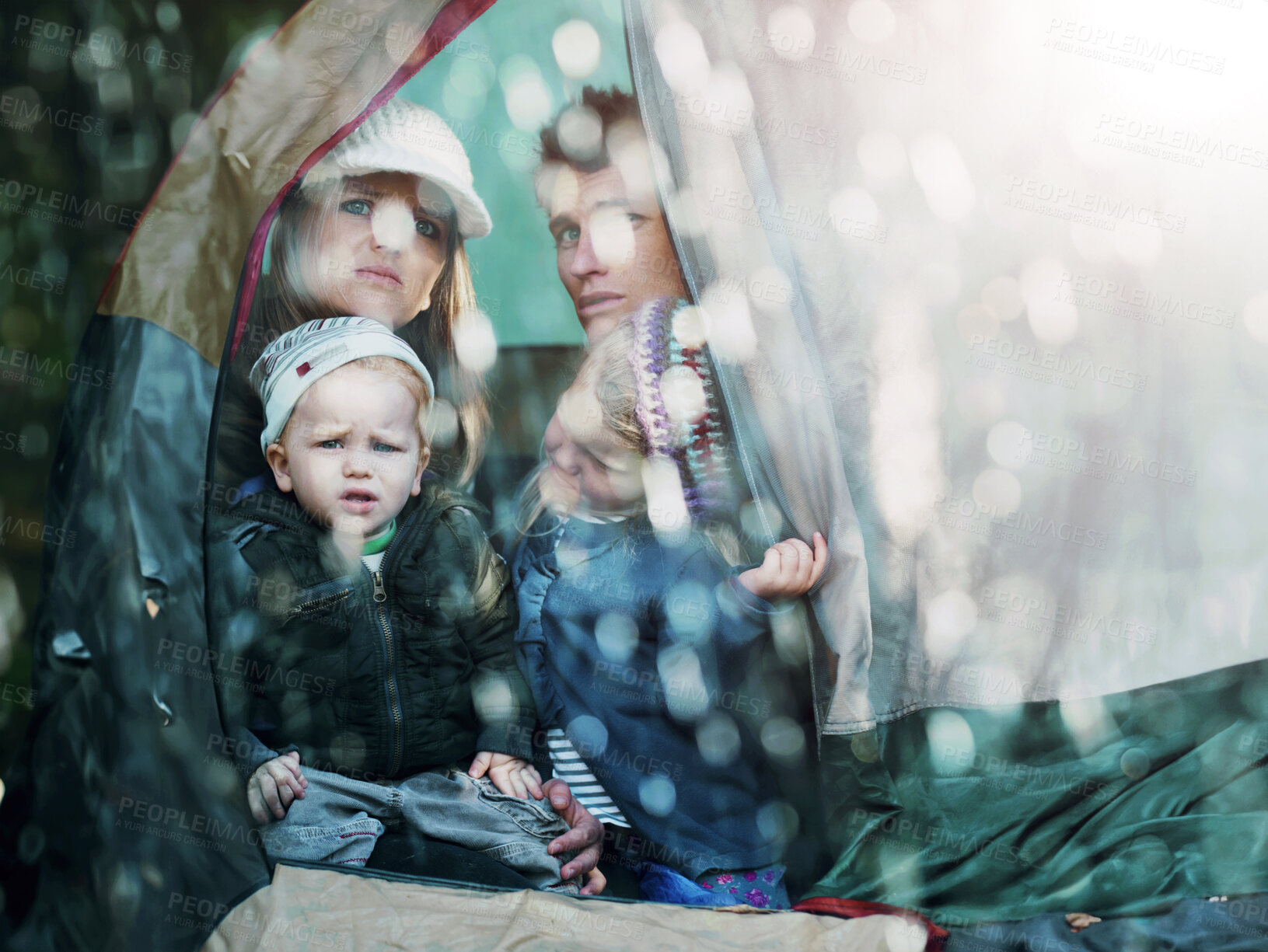 Buy stock photo Camping, family and parents with children in rain sad for adventure, holiday and vacation in winter outdoors. Disappointed, unhappy and mother, father and kids in tent with bad weather for travel