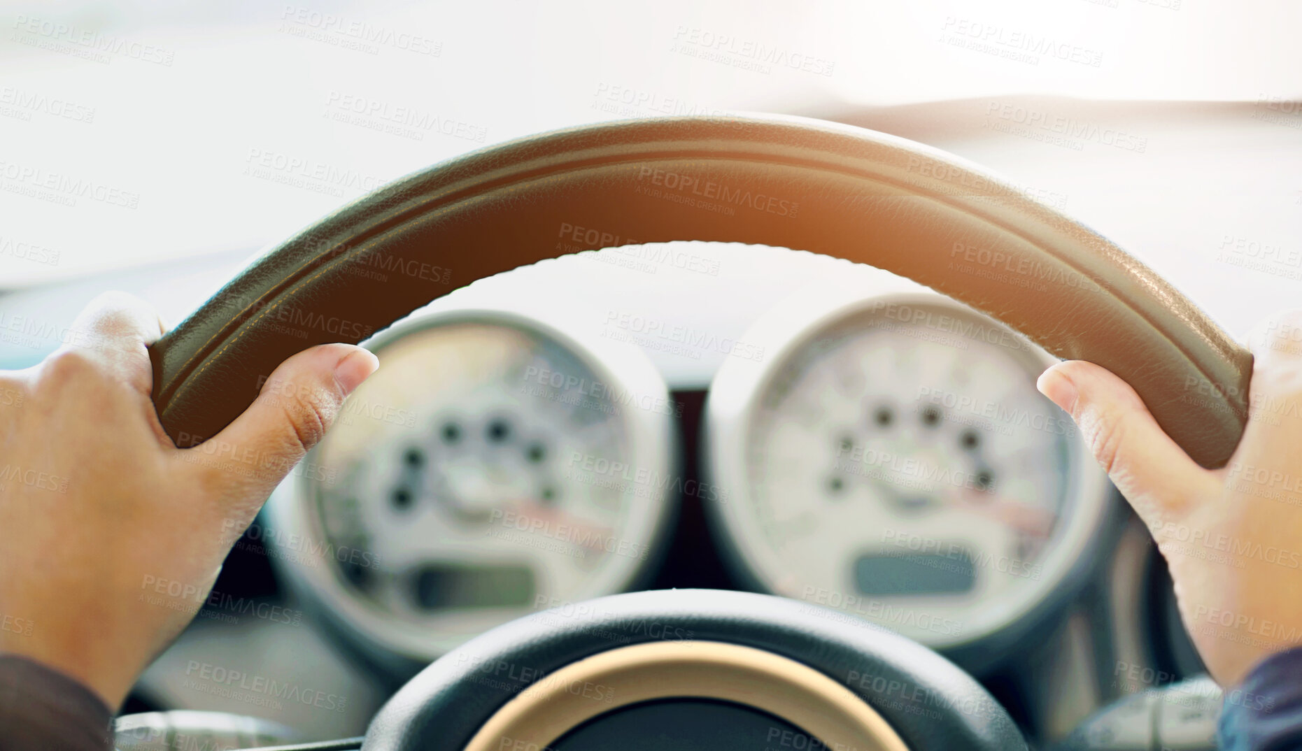 Buy stock photo Cropped view of a young woman's hands on the wheel of a new car