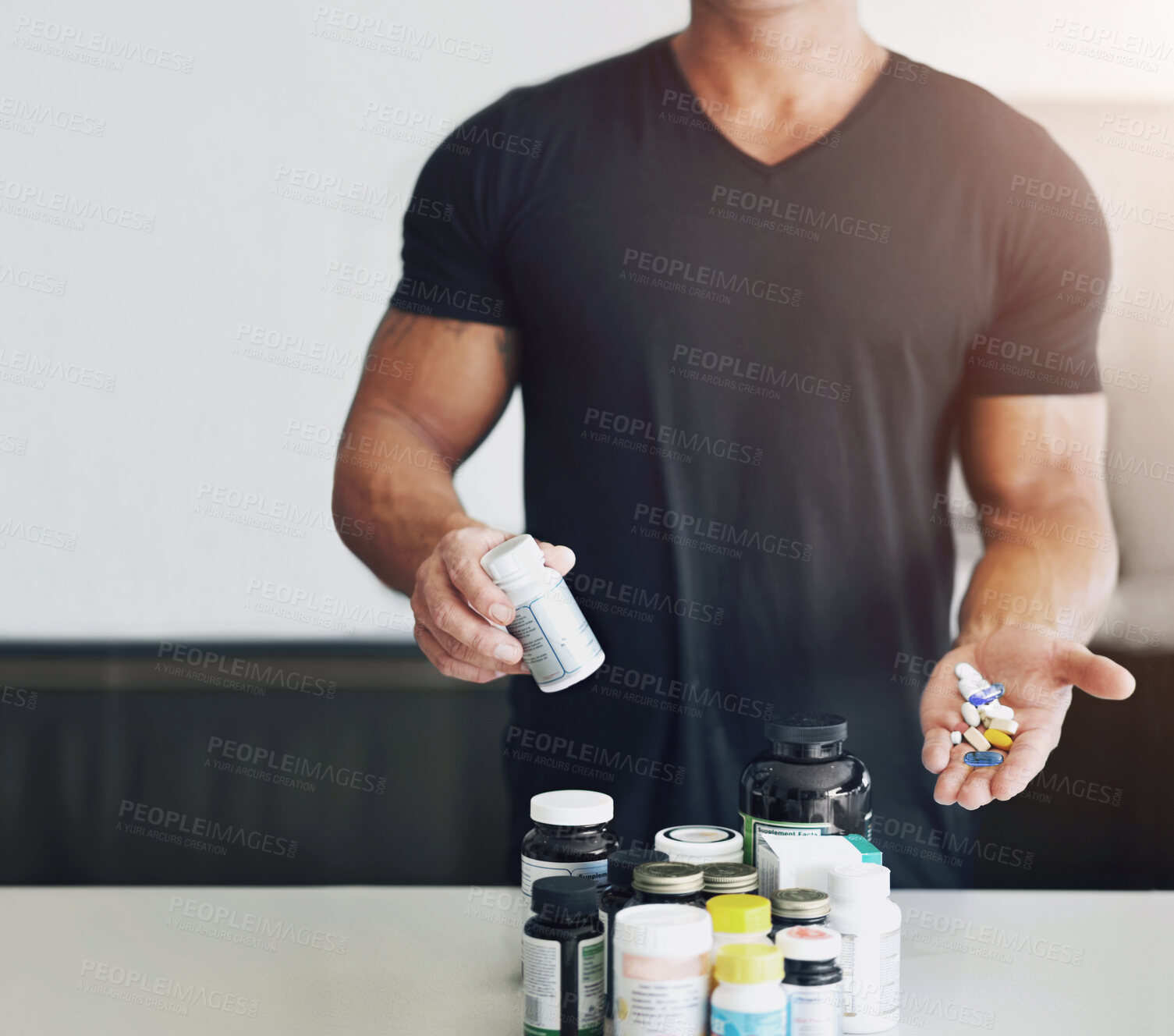 Buy stock photo Healthy, showing and man with pills for training, fitness energy and muscle gain. Diet, drugs and an athlete taking a supplement for sports, body builder protein and drugs for exercise at home