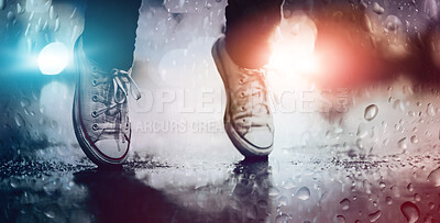 Buy stock photo Cropped image of a person wearing sneakers standing on their toes in the street