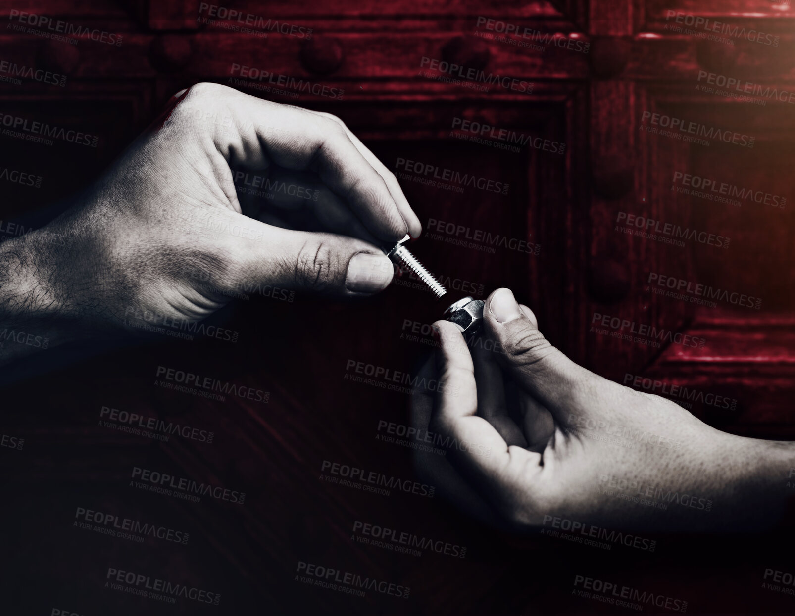 Buy stock photo Two hands screwing together a nut and bolt