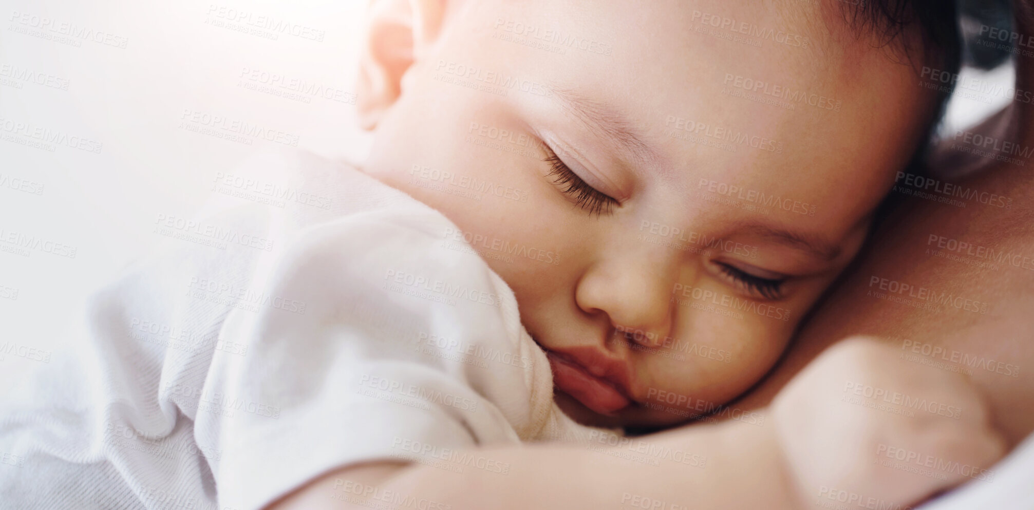 Buy stock photo Closeup of a baby girl sleeping in her mother's arms