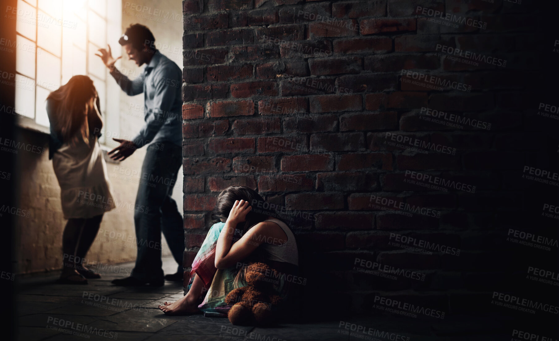 Buy stock photo Little girl huddled over while her father abuses her mother nearby