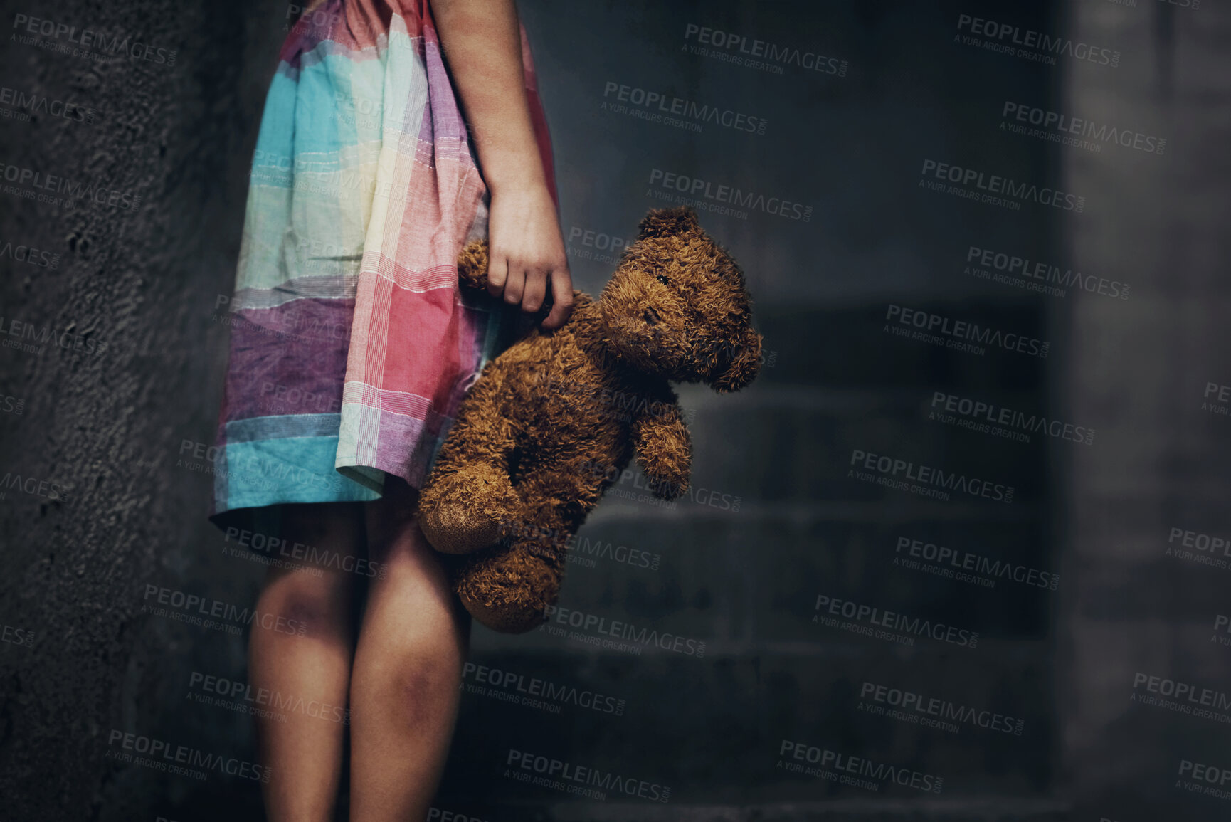 Buy stock photo Cropped view of a little girl holding a teddy bear