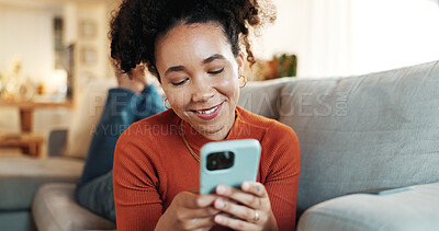 Buy stock photo Home, relax and woman on sofa, cellphone and typing with smile, texting and social media. Online reading, person and girl on couch, smartphone and mobile user with internet, connection and chatting